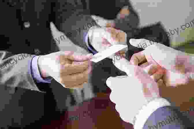 A Group Of Chinese Businesspeople Shaking Hands And Exchanging Business Cards ng Business Successfully In China (Chandos Asian Studies Series)