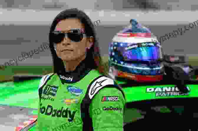 Danica Patrick Posing In Front Of A Race Car Danica Patrick (Women In Sports)