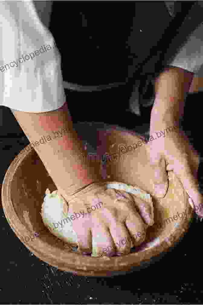 Hands Kneading A Ball Of Dough In A Wooden Bowl Flour Lab: An At Home Guide To Baking With Freshly Milled Grains